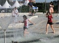 Kids play in a water of a fountain on a sunny summer day during summer break in Sofia, Bulgaria Ã¢â¬â june 15, 2012. Sunny weather c Royalty Free Stock Photo